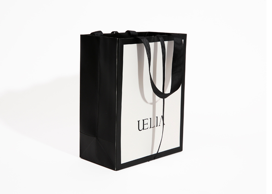 Sacco di carta boutique di lusso bianco stampato personalizzato 250g per vestiti